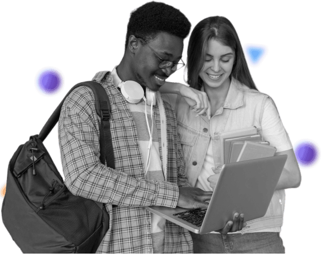 Two students looking at a laptop